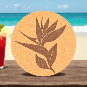 Round natural bird of paradise cork coaster featuring a laser-engraved tropical flower