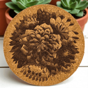 Round natural dahlia mandala cork coaster with a detailed laser-engraved dahlia bloom design