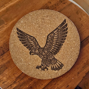 Round natural eagle cork coaster featuring a detailed laser-engraved tribal style soaring eagle design