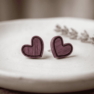 Pair of handcrafted purpleheart wood heart stud earrings with engraved inner borders