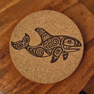 Round natural orca cork coaster with a detailed laser-engraved tribal style orca whale design