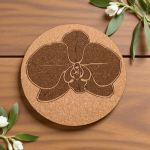 Round natural orchid cork coaster with a detailed laser-engraved orchid flower