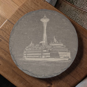 Handcrafted square Seattle slate coaster laser engraved with detailed artwork of the Space Needle and a Washington State ferry.