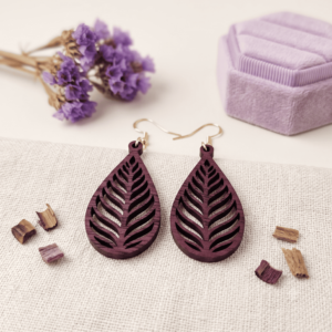 Pair of deep purple wooden leaf dangle earrings with laser-cut leaf vein patterns